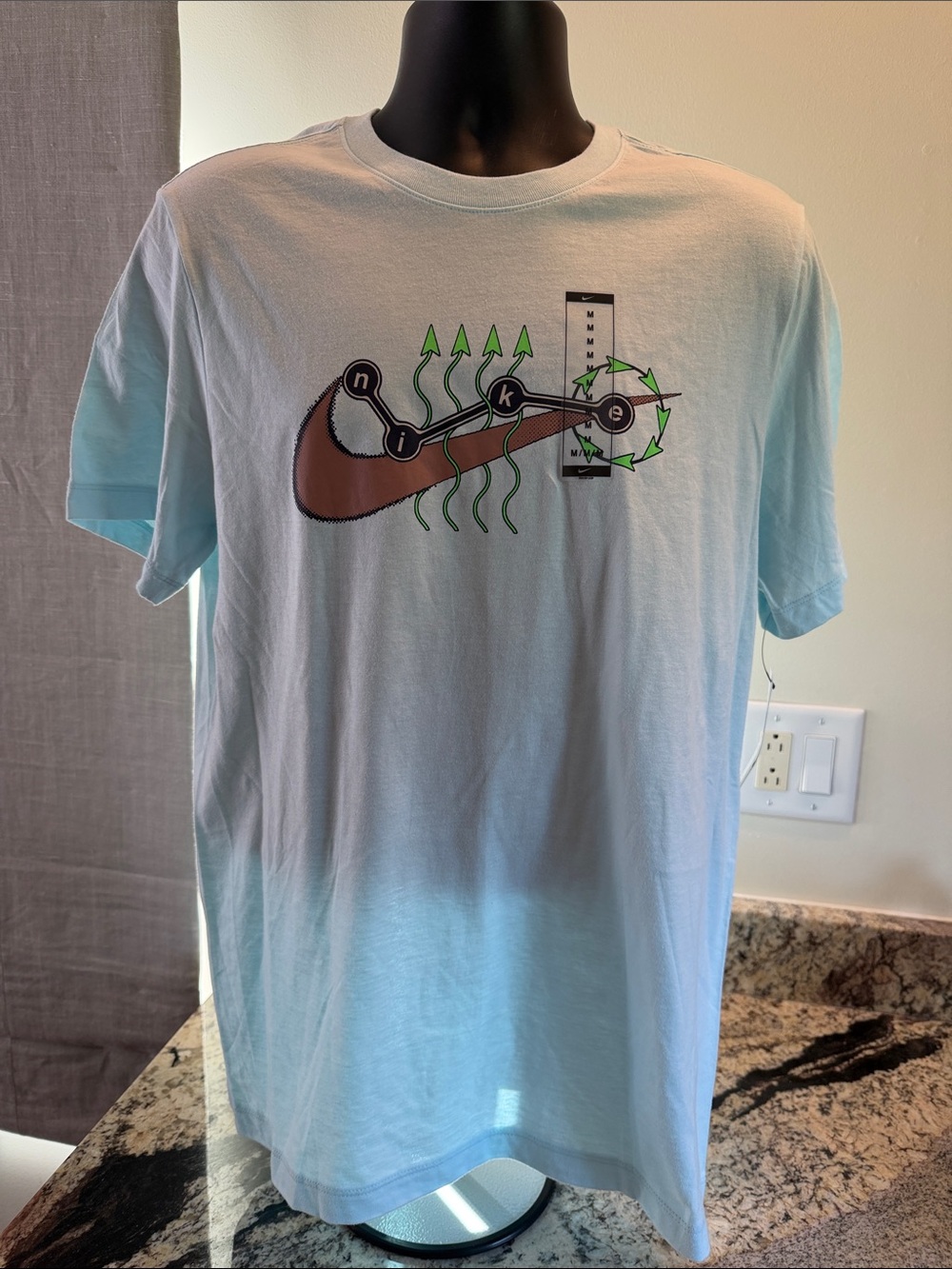 Nike Light Blue Short Sleeve Tee with Brown Swoosh and Green Accents